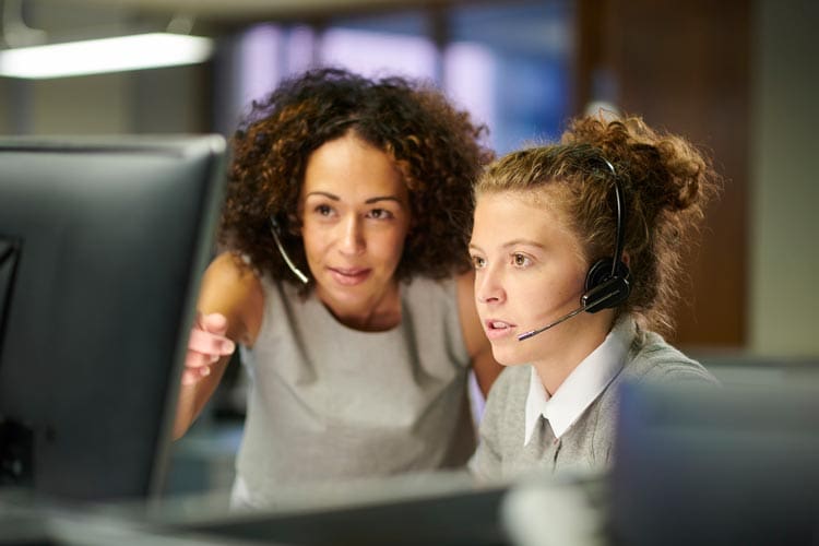 teacher with student doing a level 2 digital apprenticeship