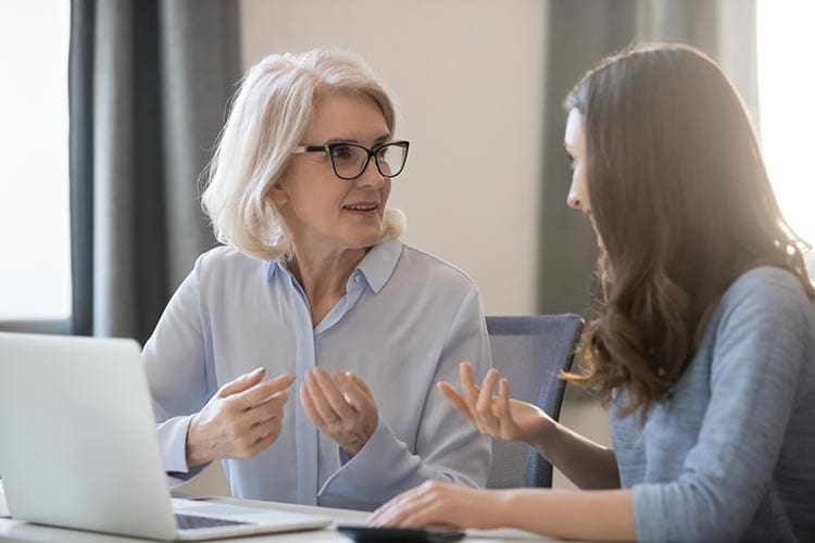 two women talking about employer engagement strategies