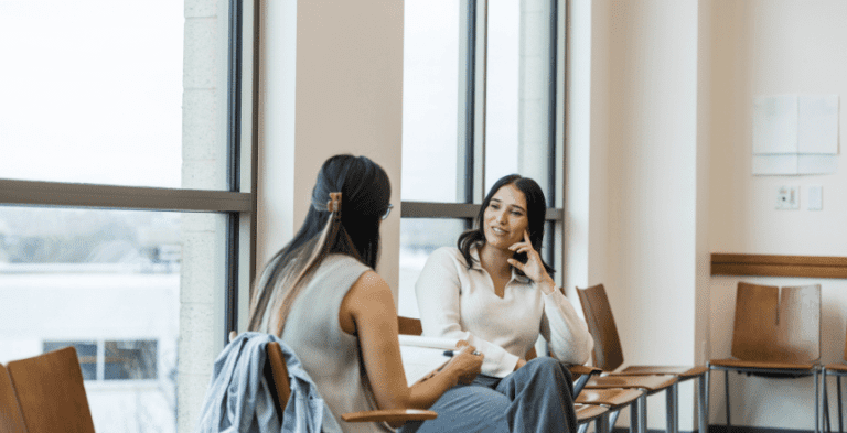 women discussing apprenticeship progress review process