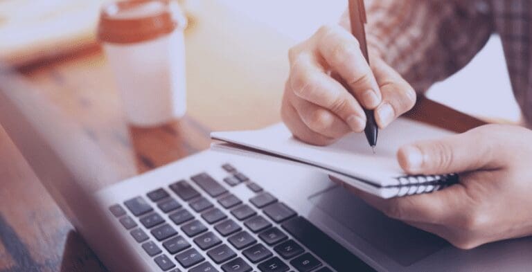 person making notes on apprenticeship functional skills