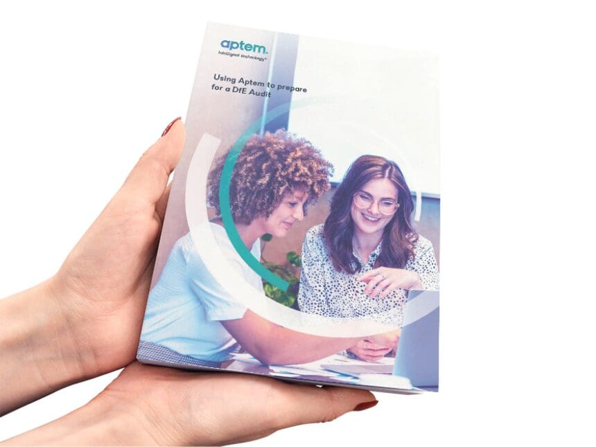 hands holding a copy of Aptem's "Using Aptem to prepare for DfE audit" guide