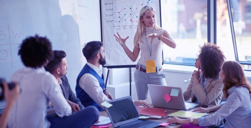 woman leading a training session in small office