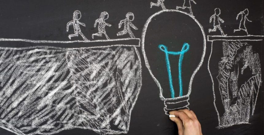 chalk drawing of a lightbuld bridging a gap to allow people to cross